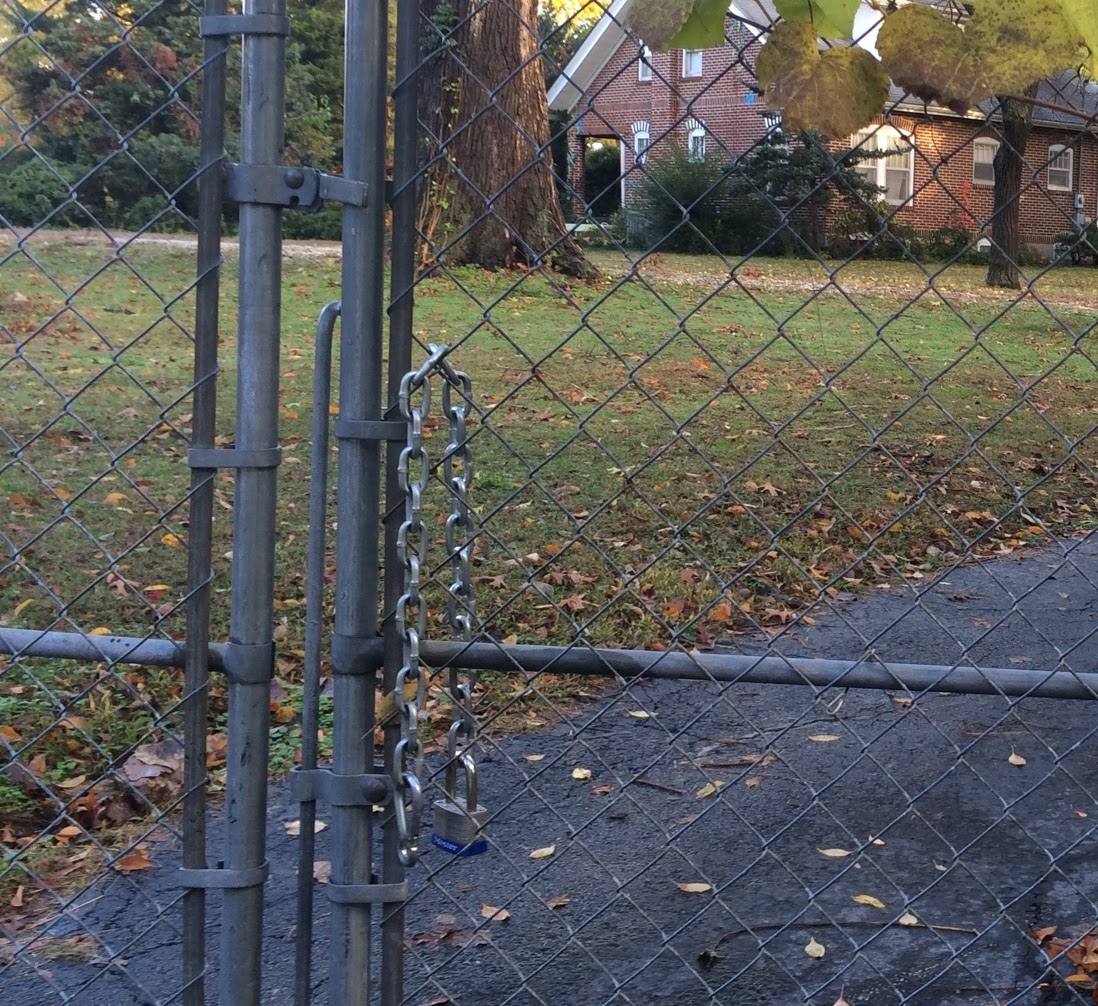 A fake chain lock on a gate.