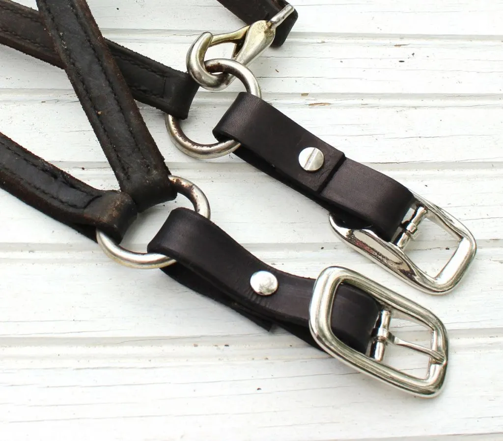 Process photo showing buckles being replaced on a leather halter. 