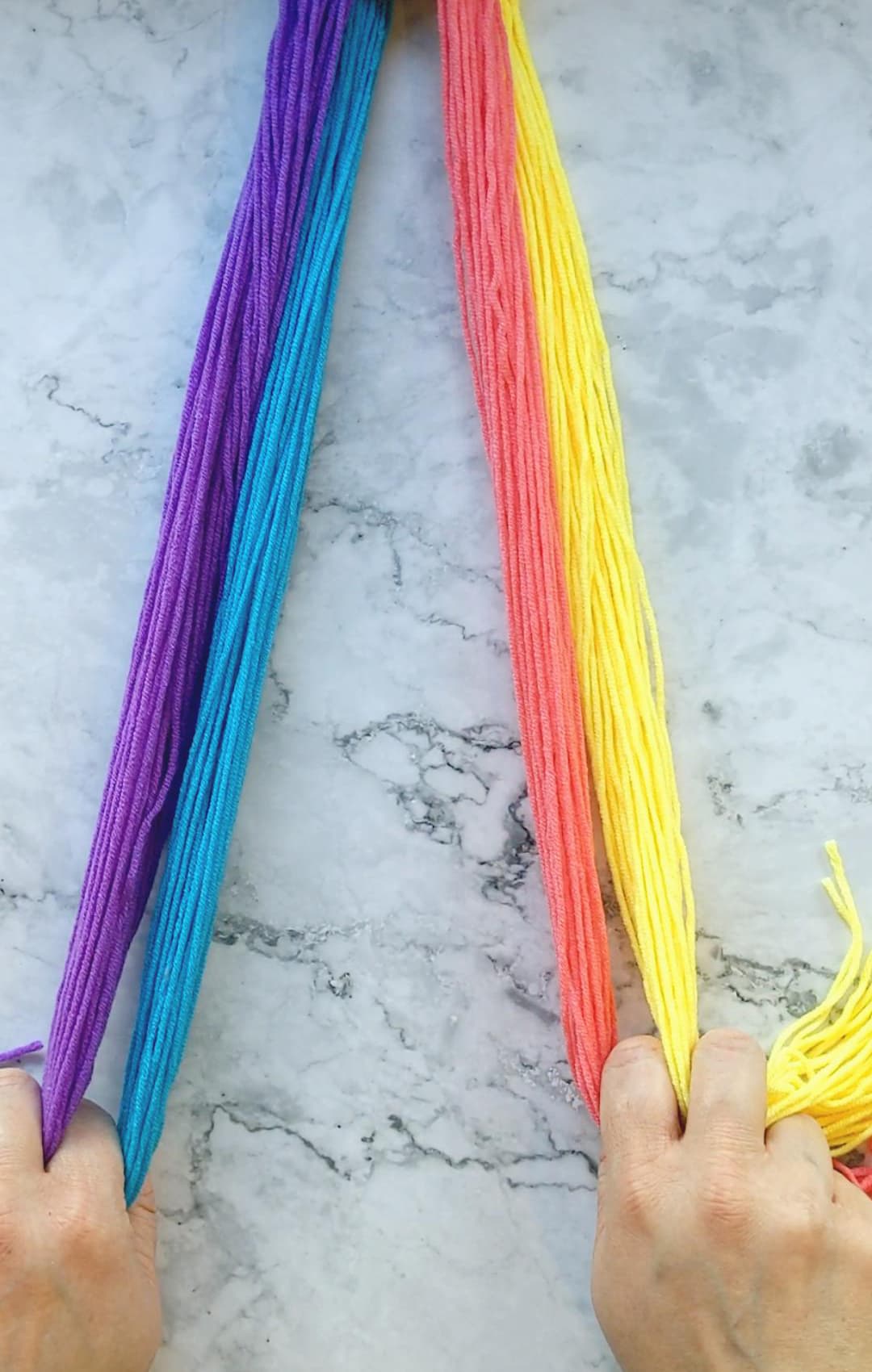 hands braiding a four strand braid