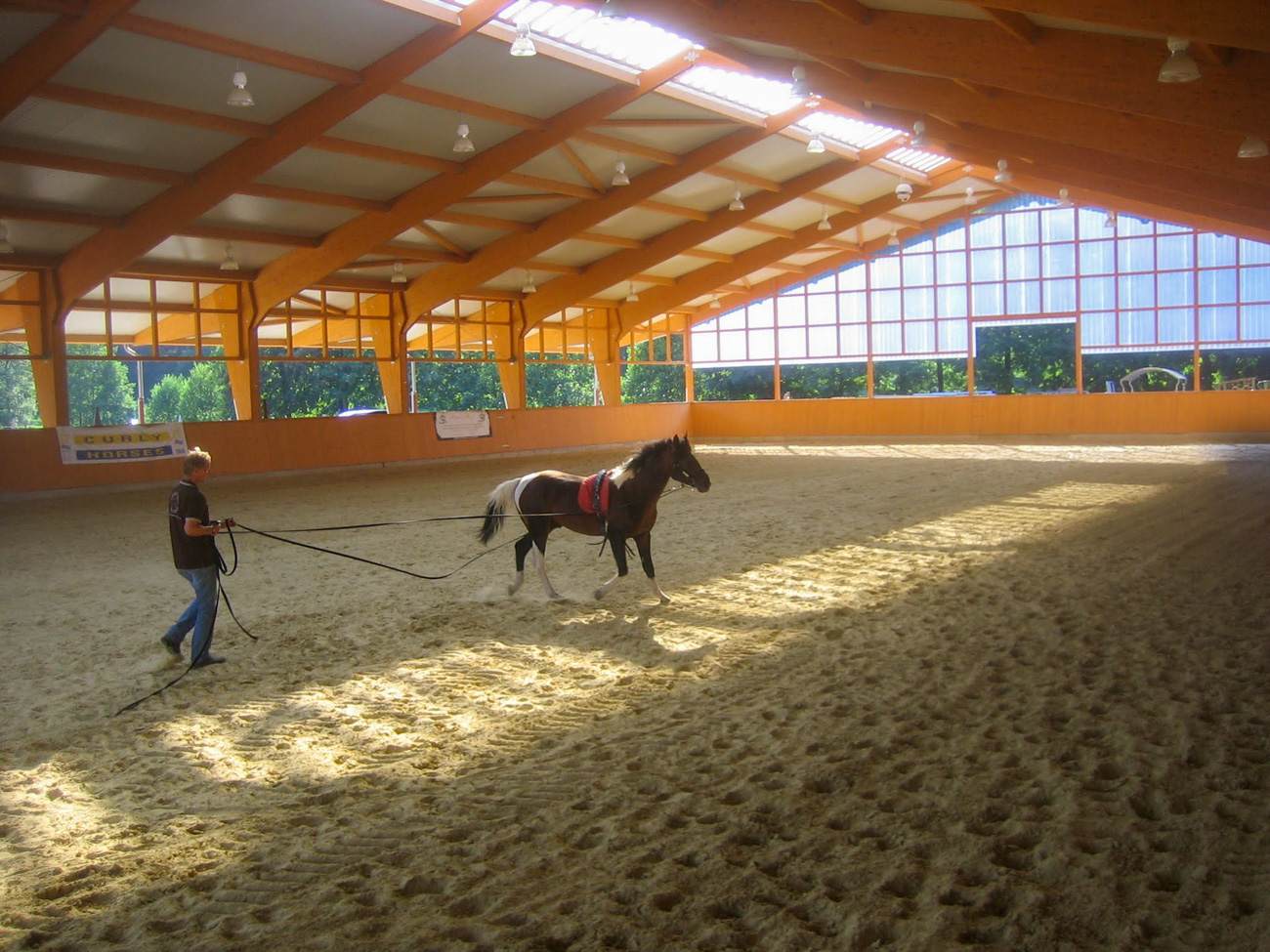 Open air arenas can reduce the concentration of horse odors in clothing after riding.