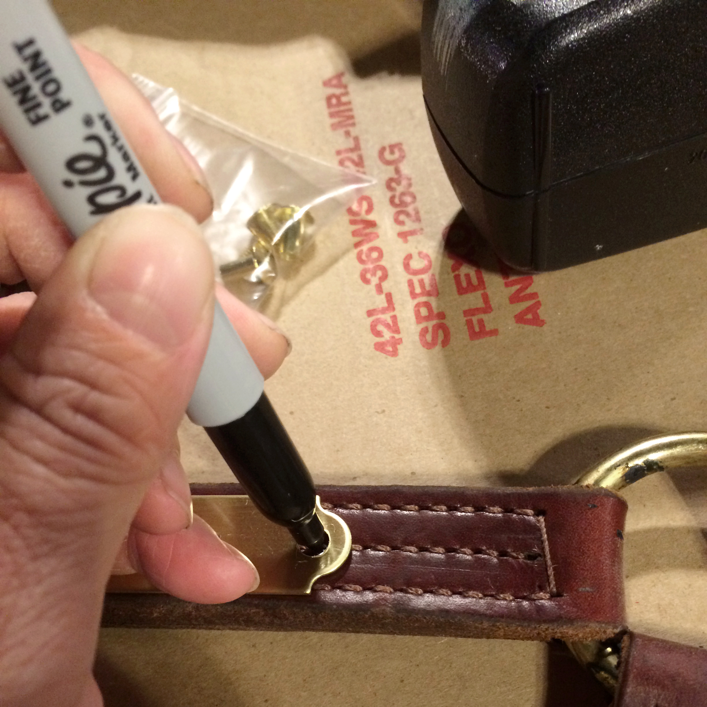 marking holes on the leather.